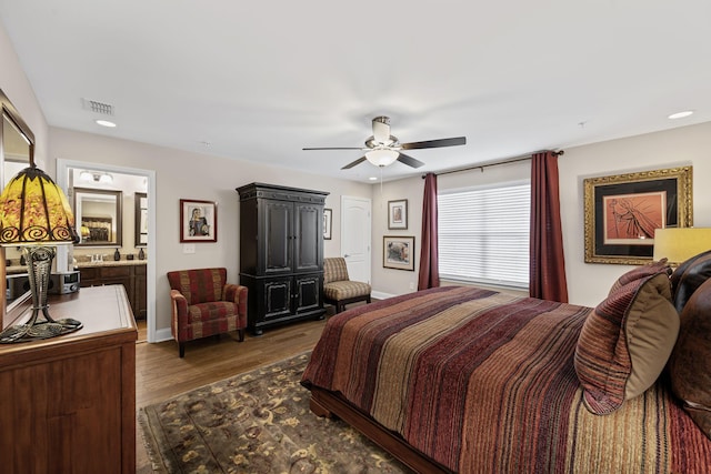 bedroom with ceiling fan and dark hardwood / wood-style floors