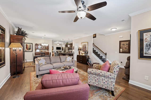 living room with crown molding, ceiling fan, and dark hardwood / wood-style flooring