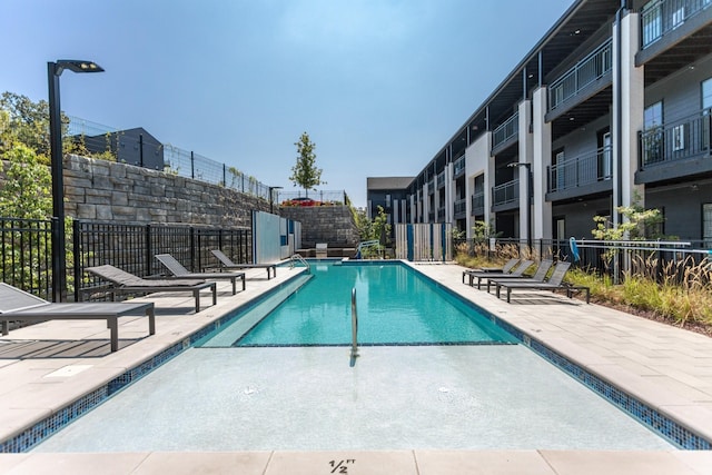 view of pool featuring a patio