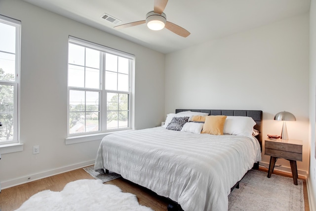 bedroom featuring ceiling fan and light hardwood / wood-style floors