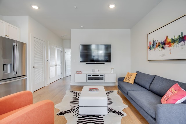 living room with light hardwood / wood-style flooring