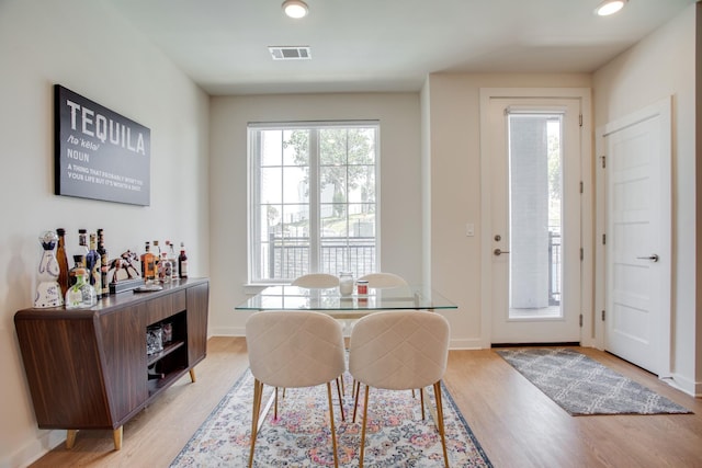 dining space with light hardwood / wood-style floors