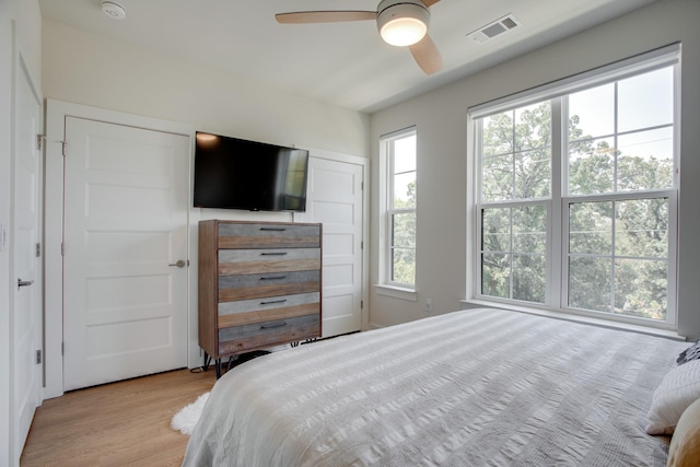 bedroom featuring light hardwood / wood-style flooring and ceiling fan