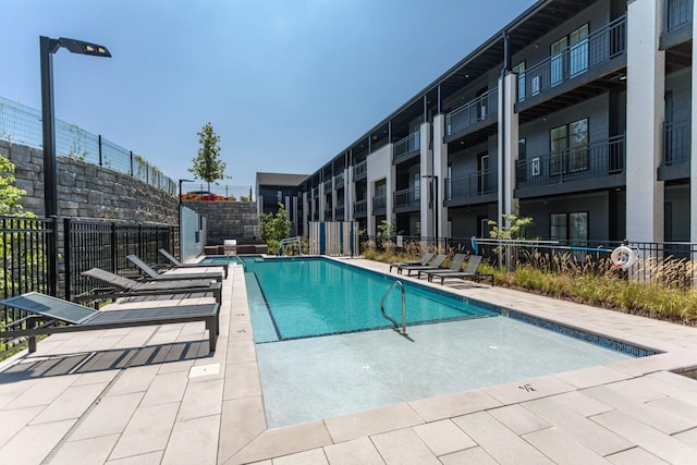 view of pool featuring a patio area