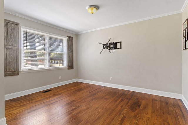 unfurnished room with ornamental molding and dark hardwood / wood-style floors