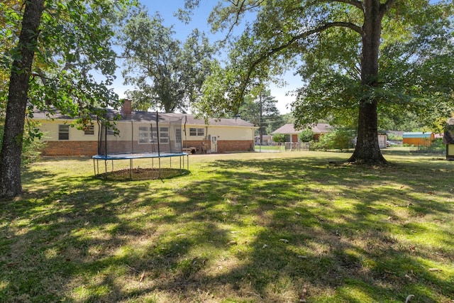 view of yard with a trampoline