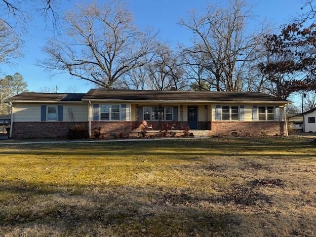 single story home with a front yard, crawl space, and brick siding