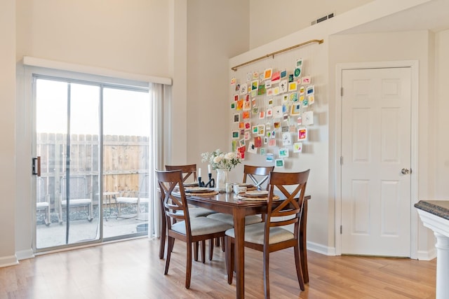 dining space featuring light hardwood / wood-style floors