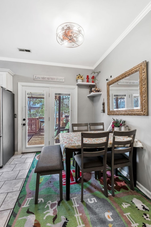 dining room with ornamental molding