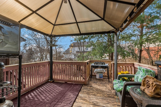 deck featuring a grill and a gazebo