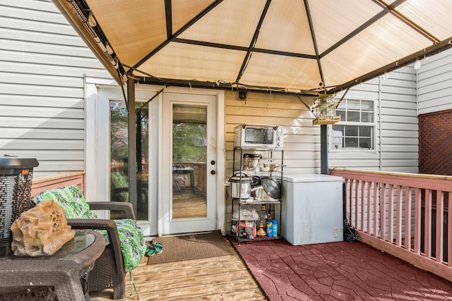 wooden deck featuring a gazebo