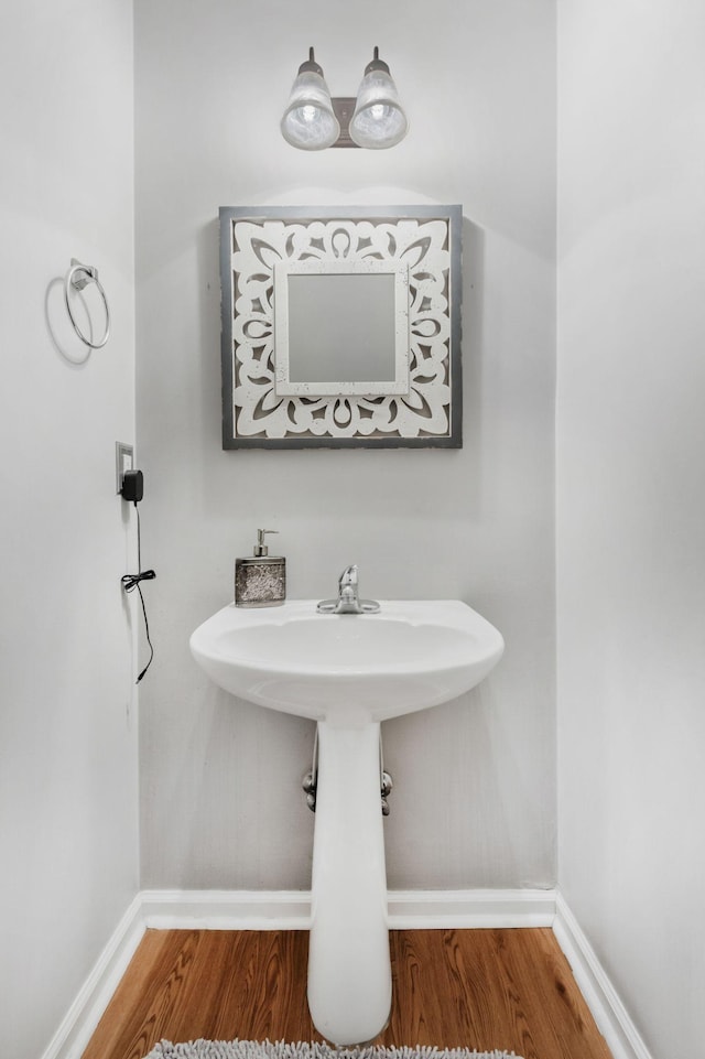 bathroom featuring hardwood / wood-style flooring and sink