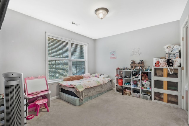 bedroom featuring carpet flooring and heating unit