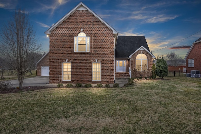 property exterior at dusk with a yard