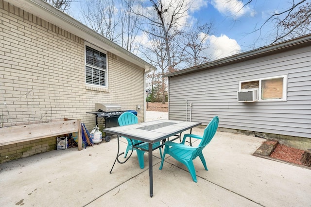 view of patio featuring a grill and cooling unit