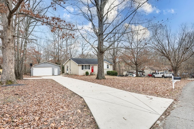 view of front of property featuring an outbuilding and a garage