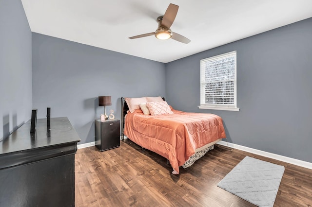 bedroom with dark wood-type flooring and ceiling fan