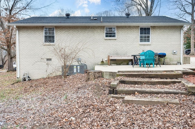 back of house featuring central AC unit and a patio