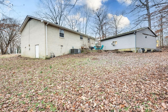 rear view of house with cooling unit