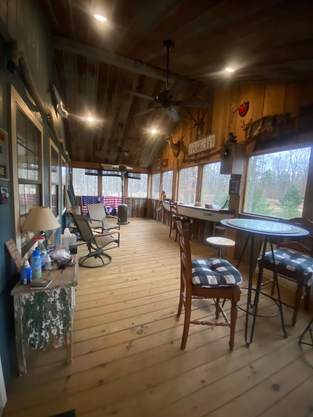 interior space with ceiling fan