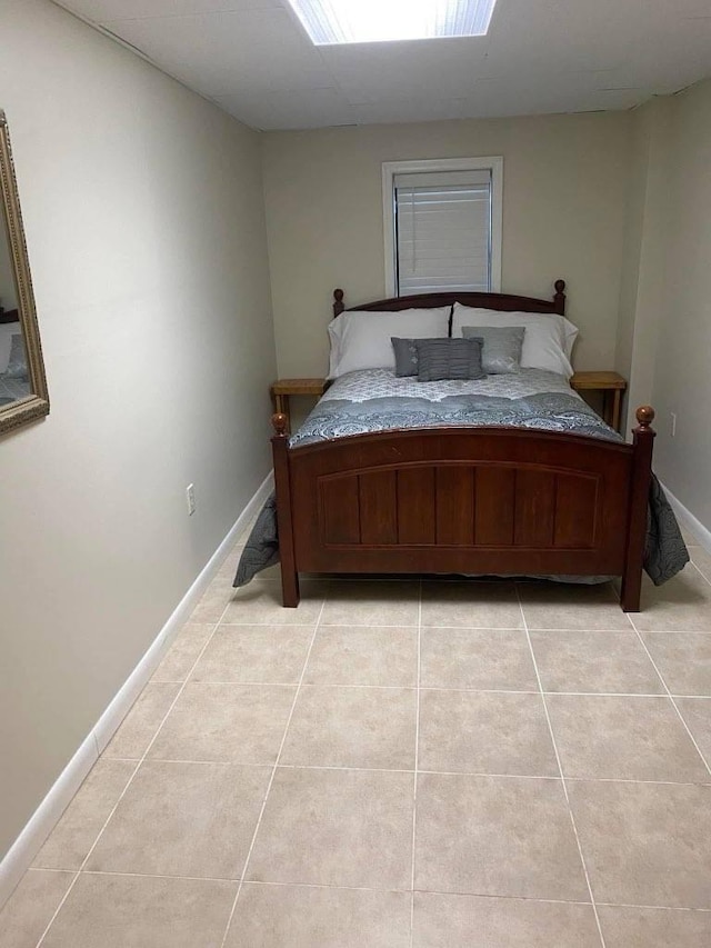 bedroom with light tile patterned flooring