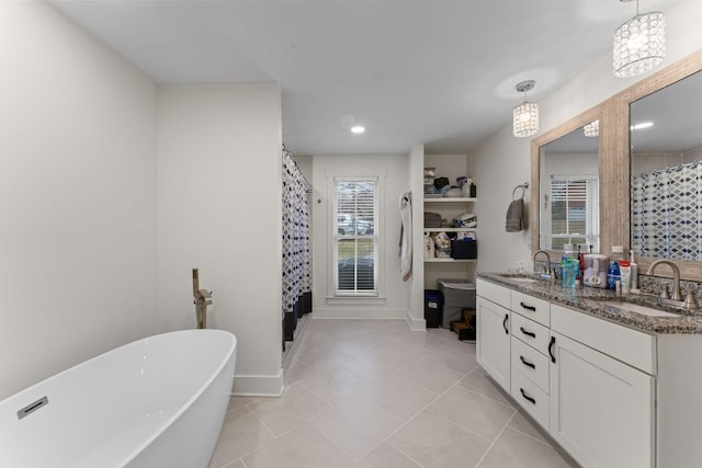 bathroom featuring independent shower and bath, vanity, and tile patterned flooring