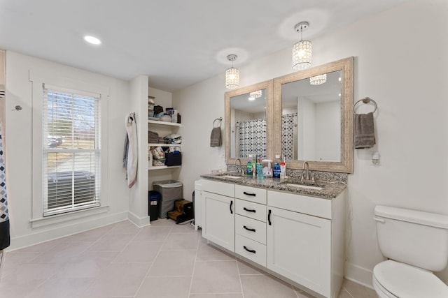 bathroom with vanity, tile patterned floors, toilet, and a shower with shower curtain