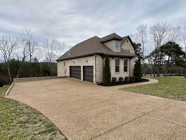 view of side of home with a lawn