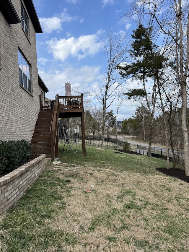 view of yard featuring a wooden deck