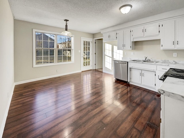 kitchen with hanging light fixtures, white cabinetry, sink, and stainless steel dishwasher