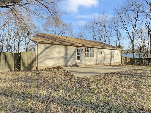 back of house with fence and a patio