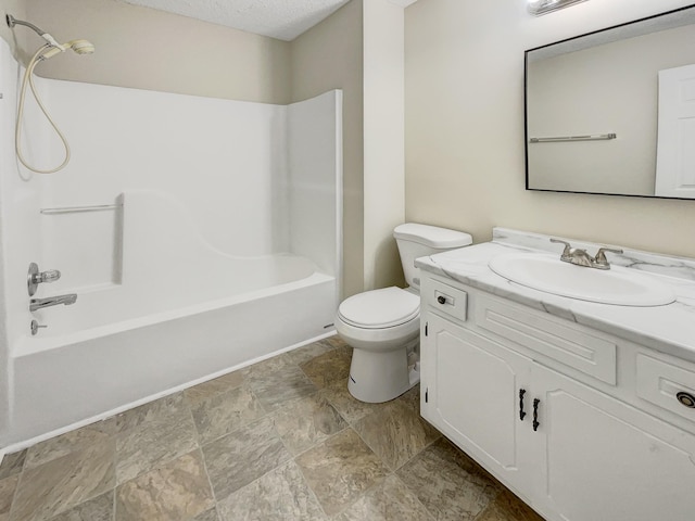 full bathroom featuring shower / tub combination, vanity, a textured ceiling, and toilet