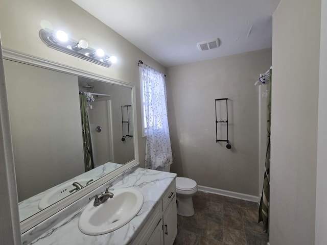 full bathroom with toilet, baseboards, visible vents, and vanity