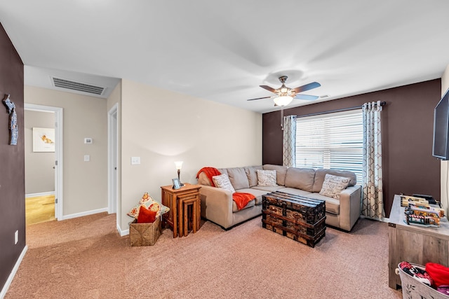 living room featuring light colored carpet and ceiling fan