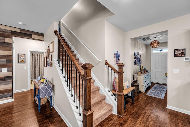 staircase with wood-type flooring