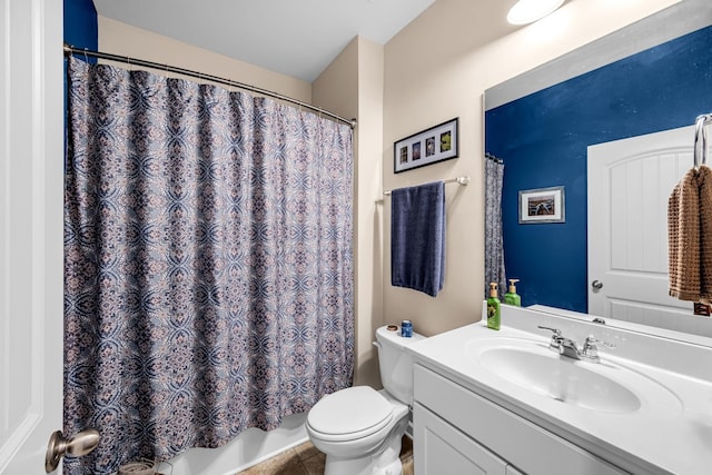 bathroom with tile patterned flooring, vanity, and toilet