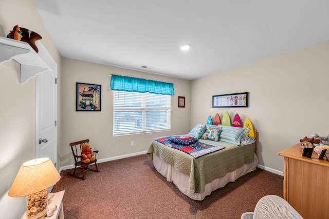 bedroom with dark colored carpet