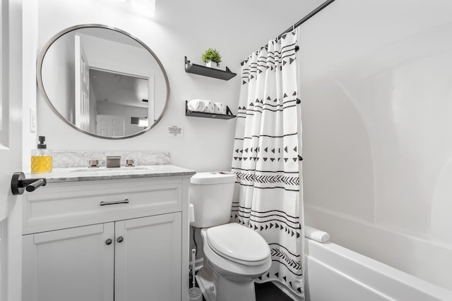 full bathroom featuring shower / tub combo with curtain, vanity, and toilet