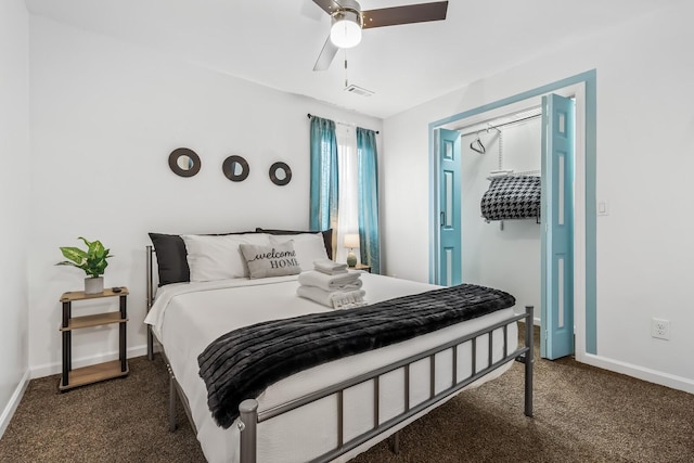 bedroom with ceiling fan and dark carpet