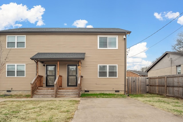 view of front facade featuring a patio and a front yard