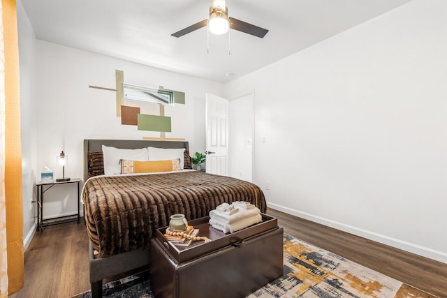 bedroom with dark wood-type flooring and ceiling fan