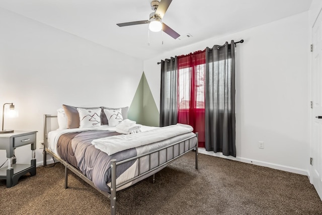 bedroom featuring ceiling fan and dark colored carpet