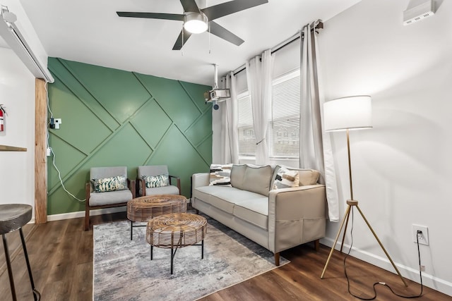 sitting room featuring ceiling fan and dark hardwood / wood-style flooring