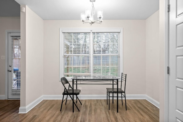 dining room with a chandelier and hardwood / wood-style floors