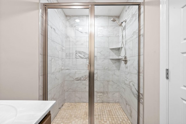 bathroom featuring an enclosed shower and vanity