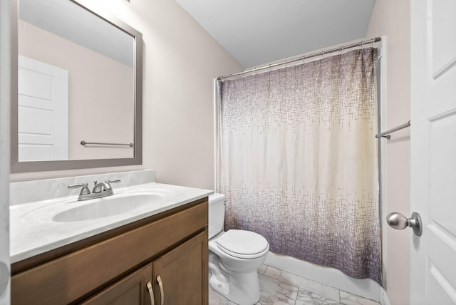 full bathroom with vanity, shower / bath combo, and toilet