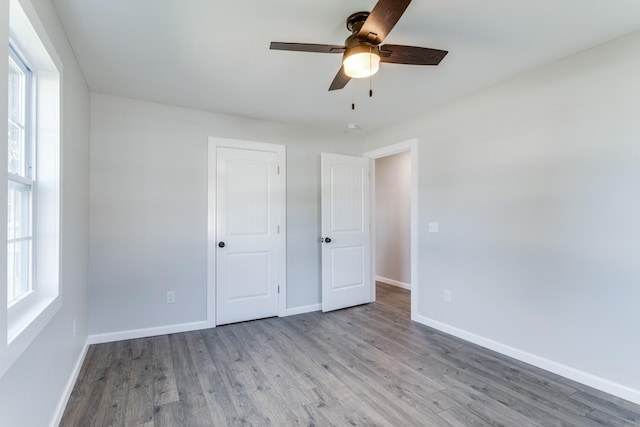 unfurnished bedroom with wood-type flooring and ceiling fan