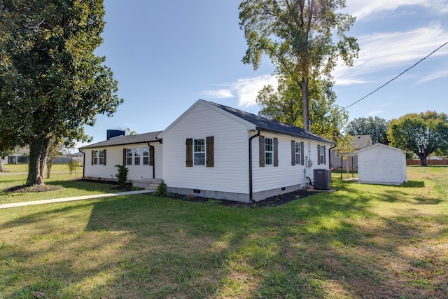 single story home with cooling unit and a front lawn