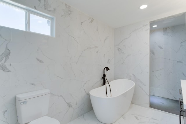 bathroom featuring toilet and a bathing tub