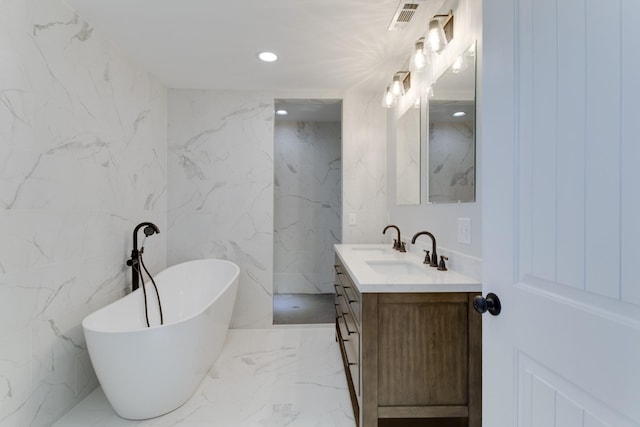 bathroom featuring vanity and a bathtub